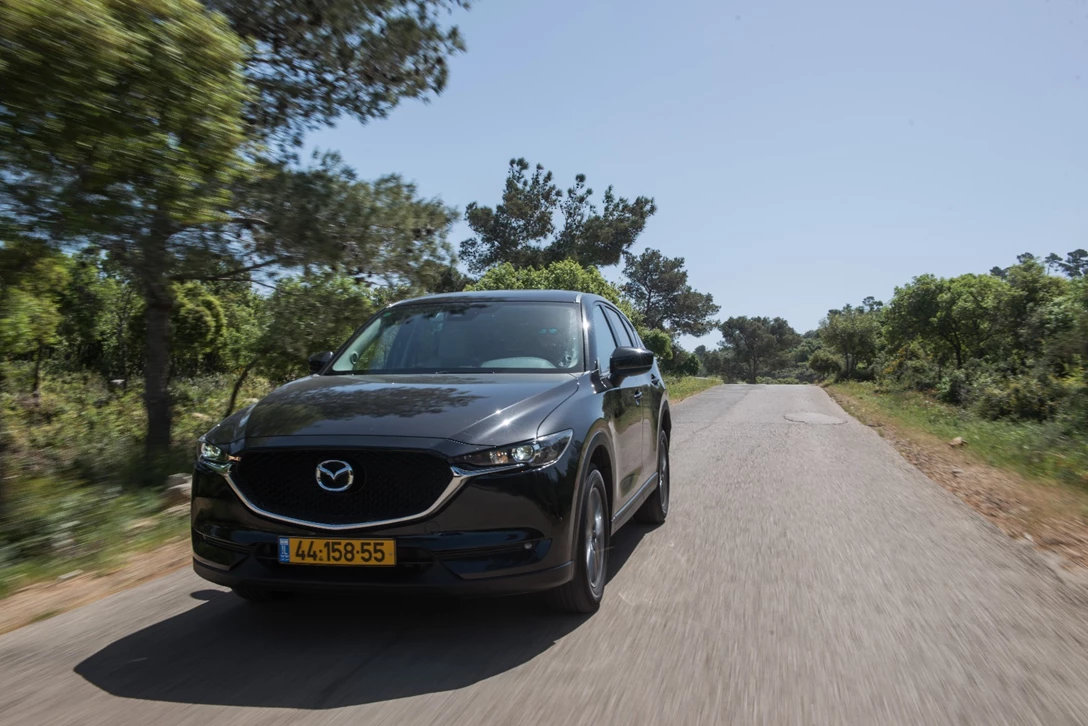 1594303-השוואתי פנאי - יונדאי טוסון מול מאזדה CX-5 מול פיגו 3008 מול קיה ספורטאז (32).jpg