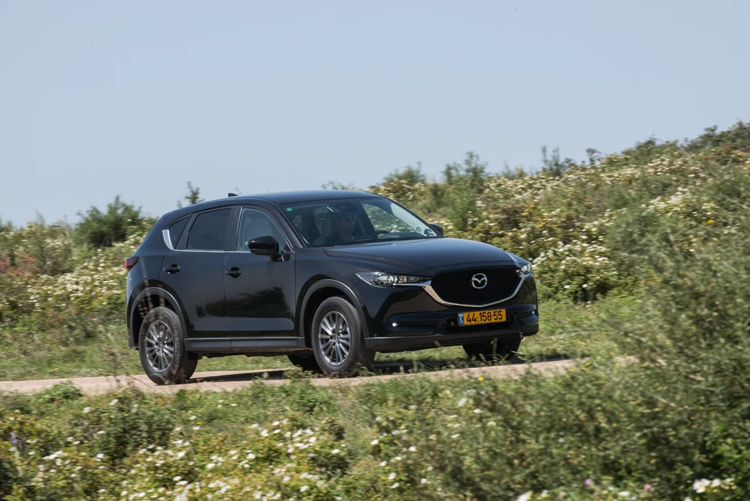 1594310-השוואתי פנאי - יונדאי טוסון מול מאזדה CX-5 מול פיגו 3008 מול קיה ספורטאז (39).jpg