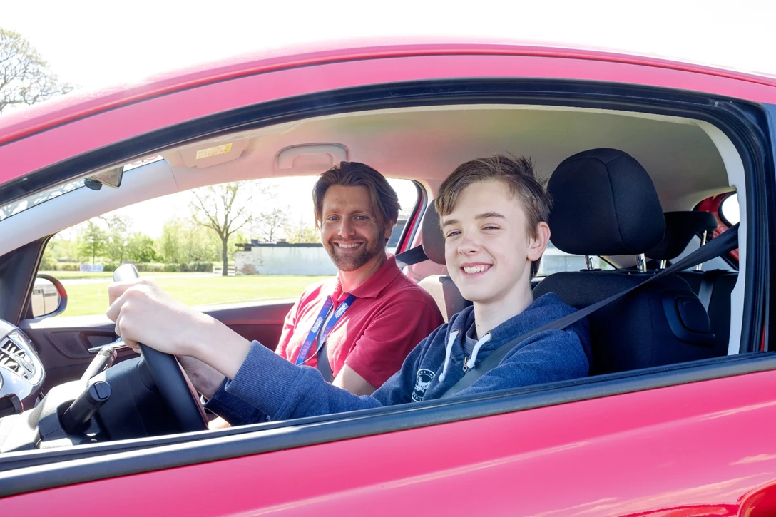 1598699-A youngster behind the wheel at a Young Driver lesson.jpg