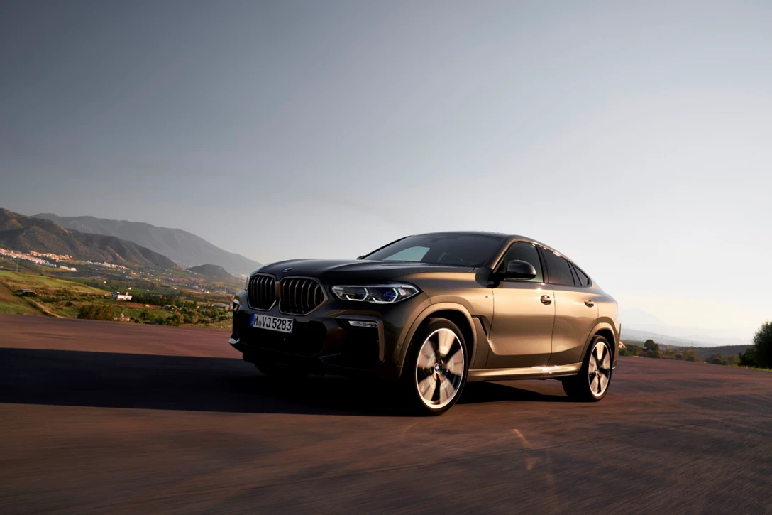 1619038-P90356698_highRes_the-new-bmw-x6-drivi.jpg